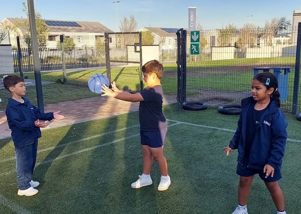 Curro Burgundy learners practising catching and ball-handling outdoors