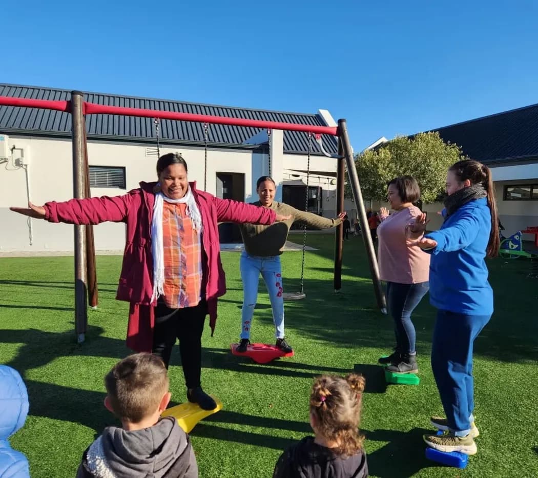 Educators practising a balance activity during Out of the Blocks training at Curro Somerset West