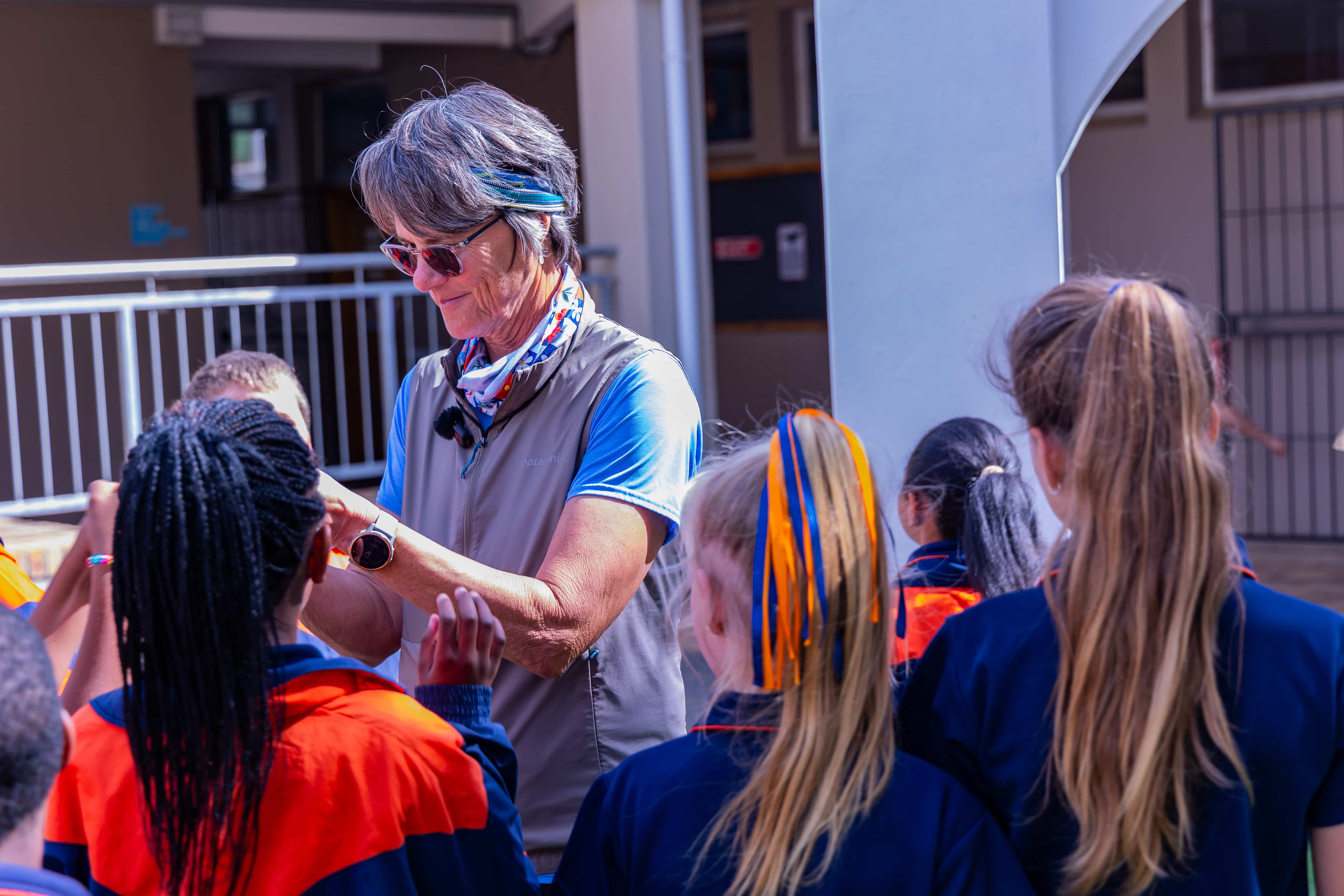 Ansu Human working with children during a movement activity